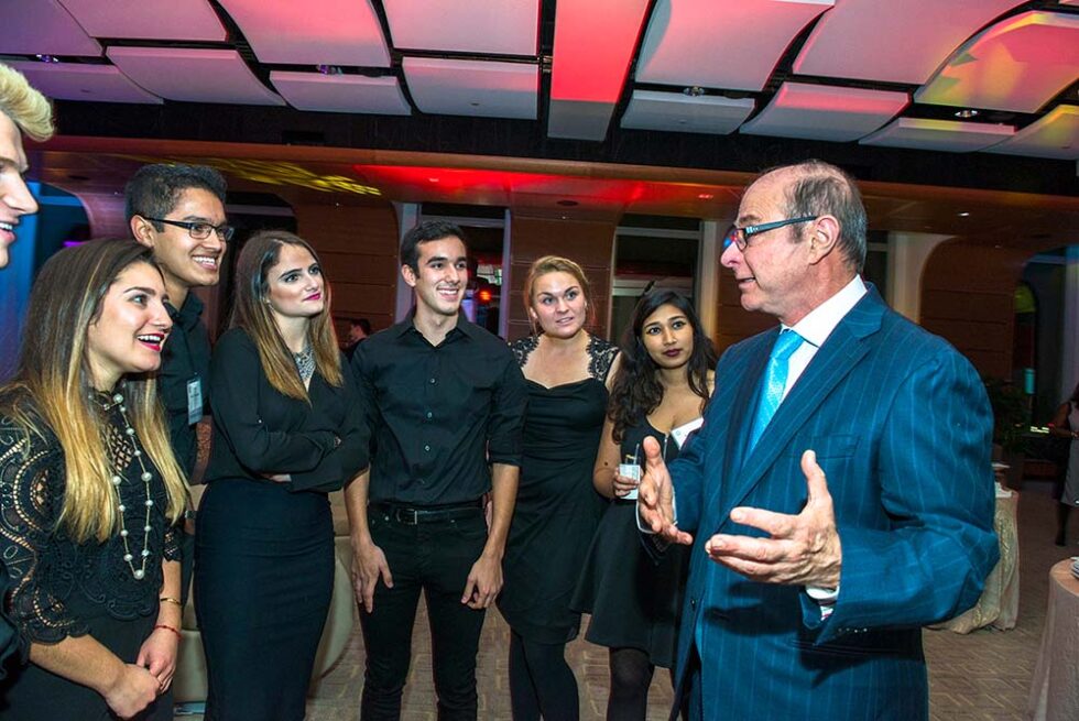people listening to a speaker at a convention