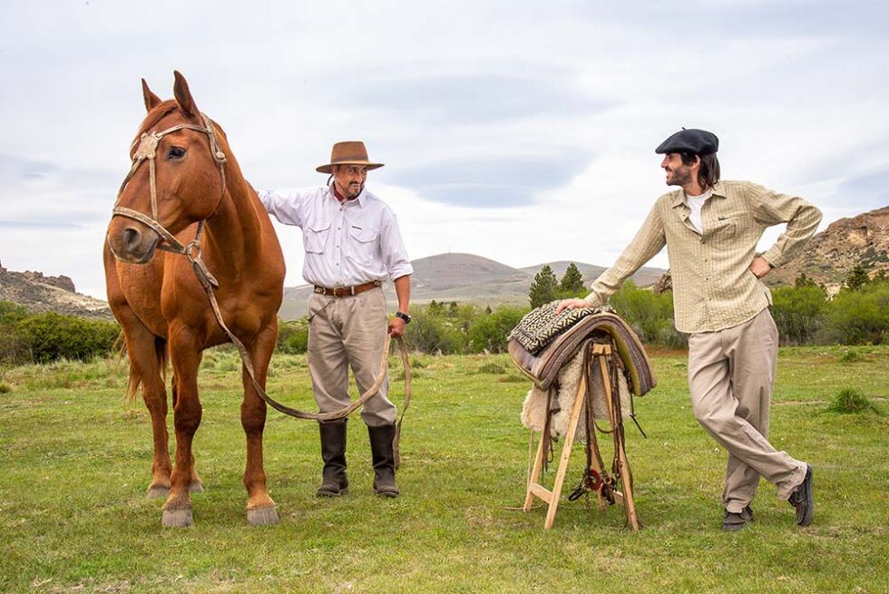 horse with two people in a field