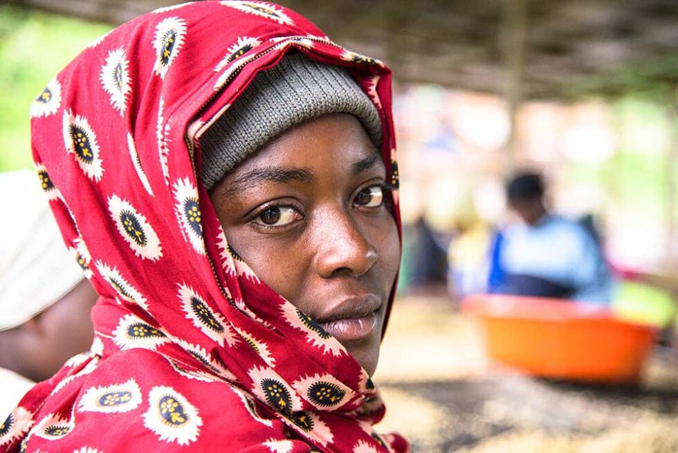 woman in red veil looking over shoulder